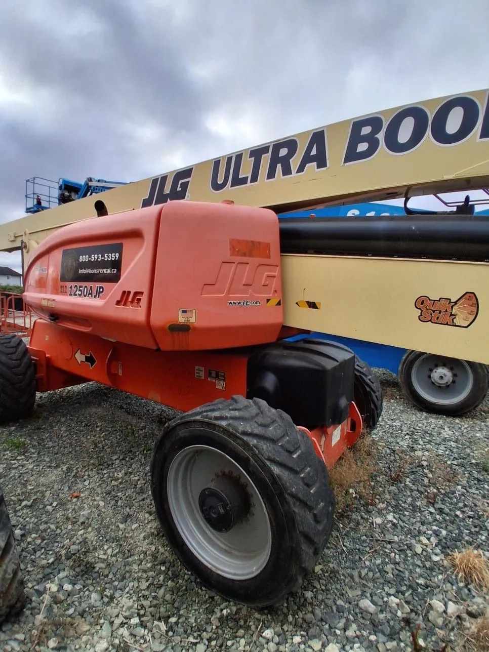 Orange JLG Ultra Boom lift parked at the Global Lions Rental yard